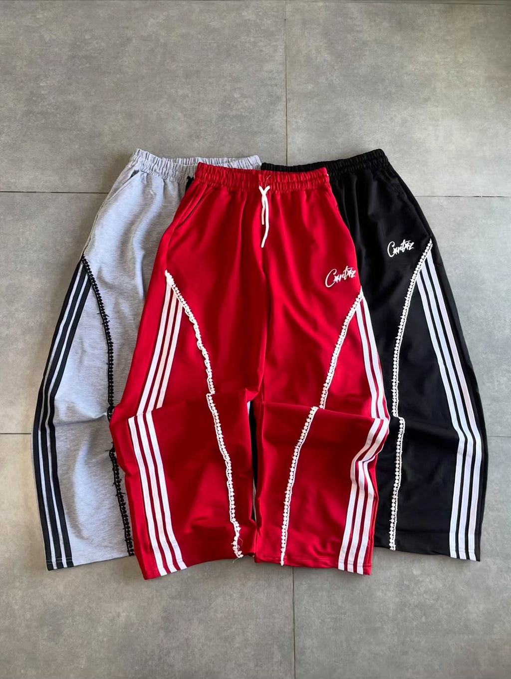 Curved Stripe Graphic Track Pants